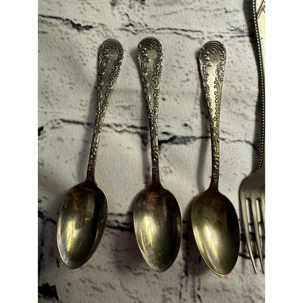Vintage baby spoons and‎ fork silver?